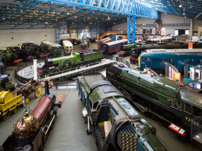 a circle of steam trains and later locomotives from the main hall at the National Railway Museum