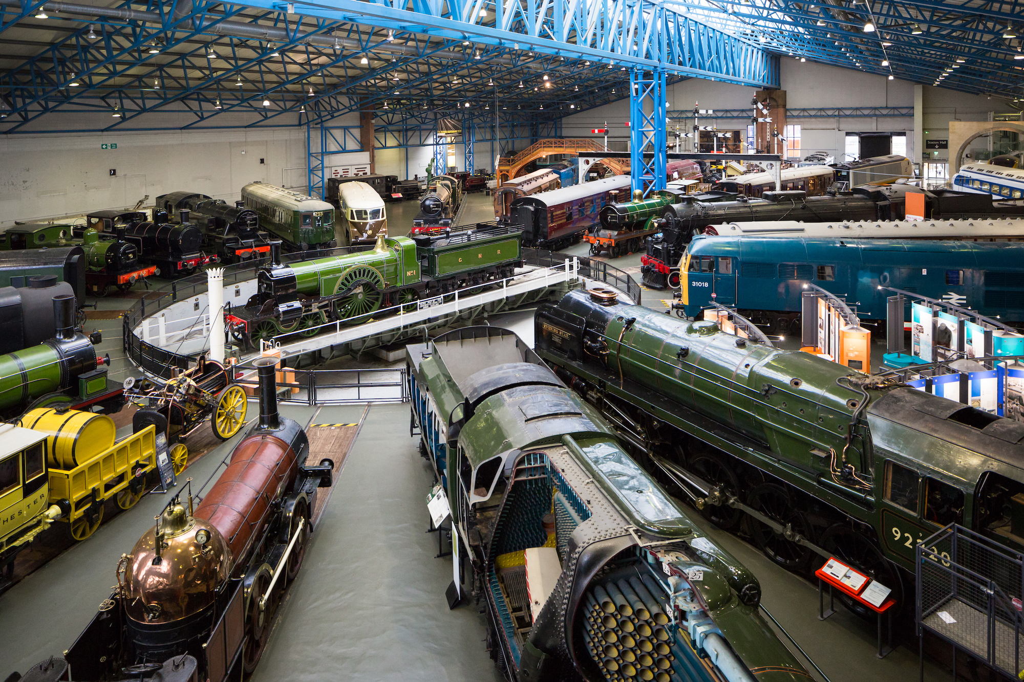 a circle of steam trains and later locomotives from the main hall at the National Railway Museum
