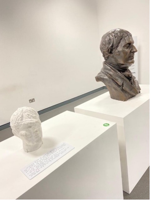 Edward Rushton display in the Skylight Gallery in November 2022, featuring a bust and a tactile model of Rushton’s head.